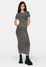 A woman modeling a short-sleeve, high-neck, bodycon midi dress in a washed charcoal gray color, styled with black combat boots against a light gray studio background.
